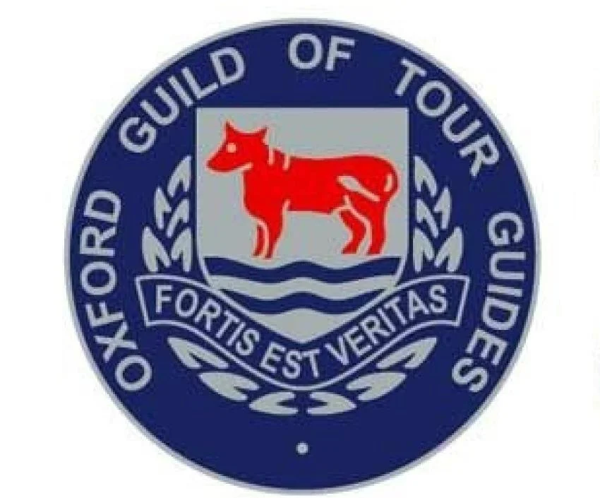 Oxford Guild of Tour Guides emblem featuring a red ox inside a shield with a Latin motto 'Fortis Est Veritas' and surrounding text 'Oxford Guild of Tour Guides'