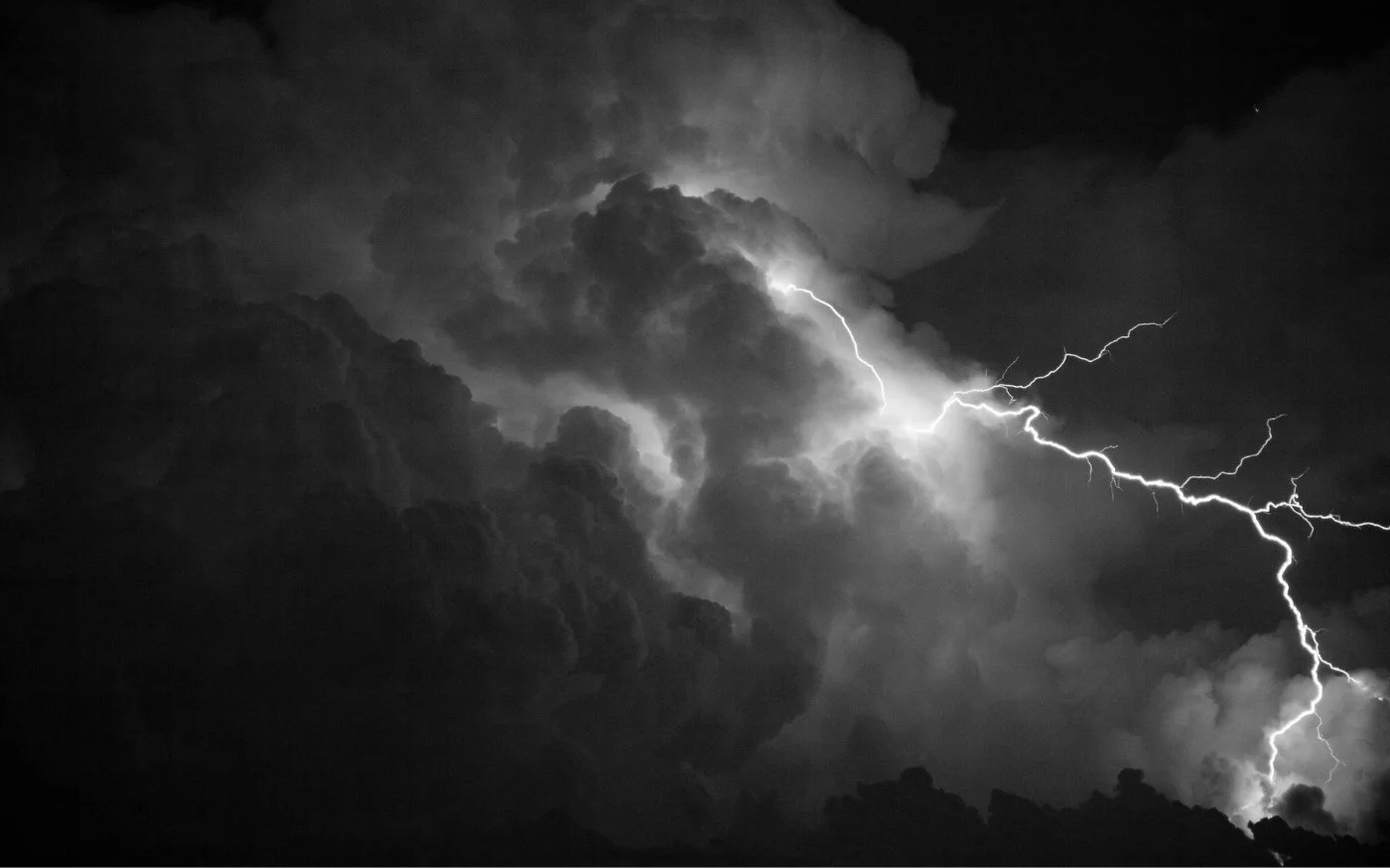 Lightning bolt striking from a dark sky