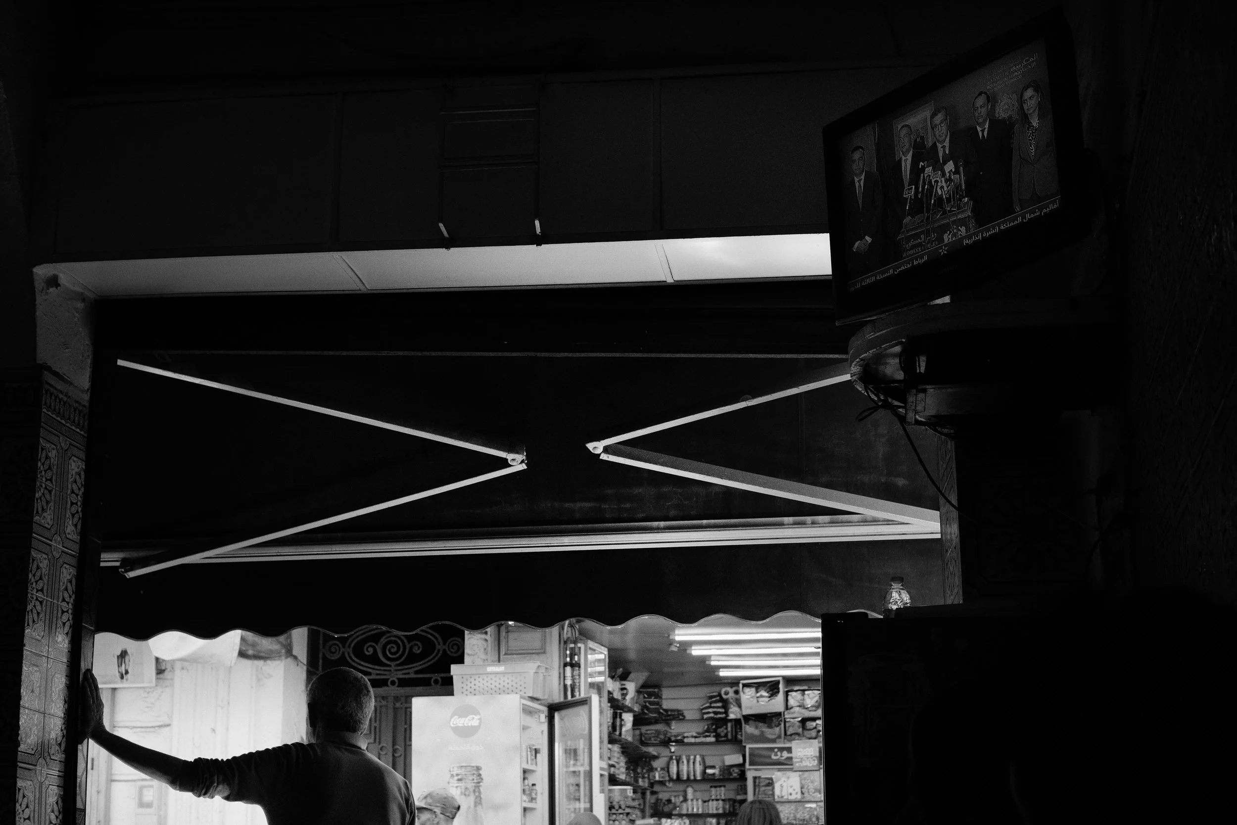 Standing at the entrance of the coffee shop, his back to the TV inside, that shows Morocco's prime minister, Aziz Akhannouch, announcing a 10 percent increase in the minimum wage.
