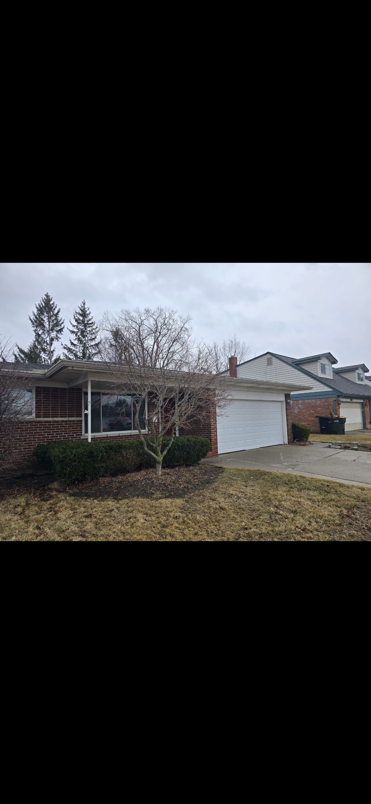 A single-story brick house had there gutters installed by dads seamless gutters worked with contractors