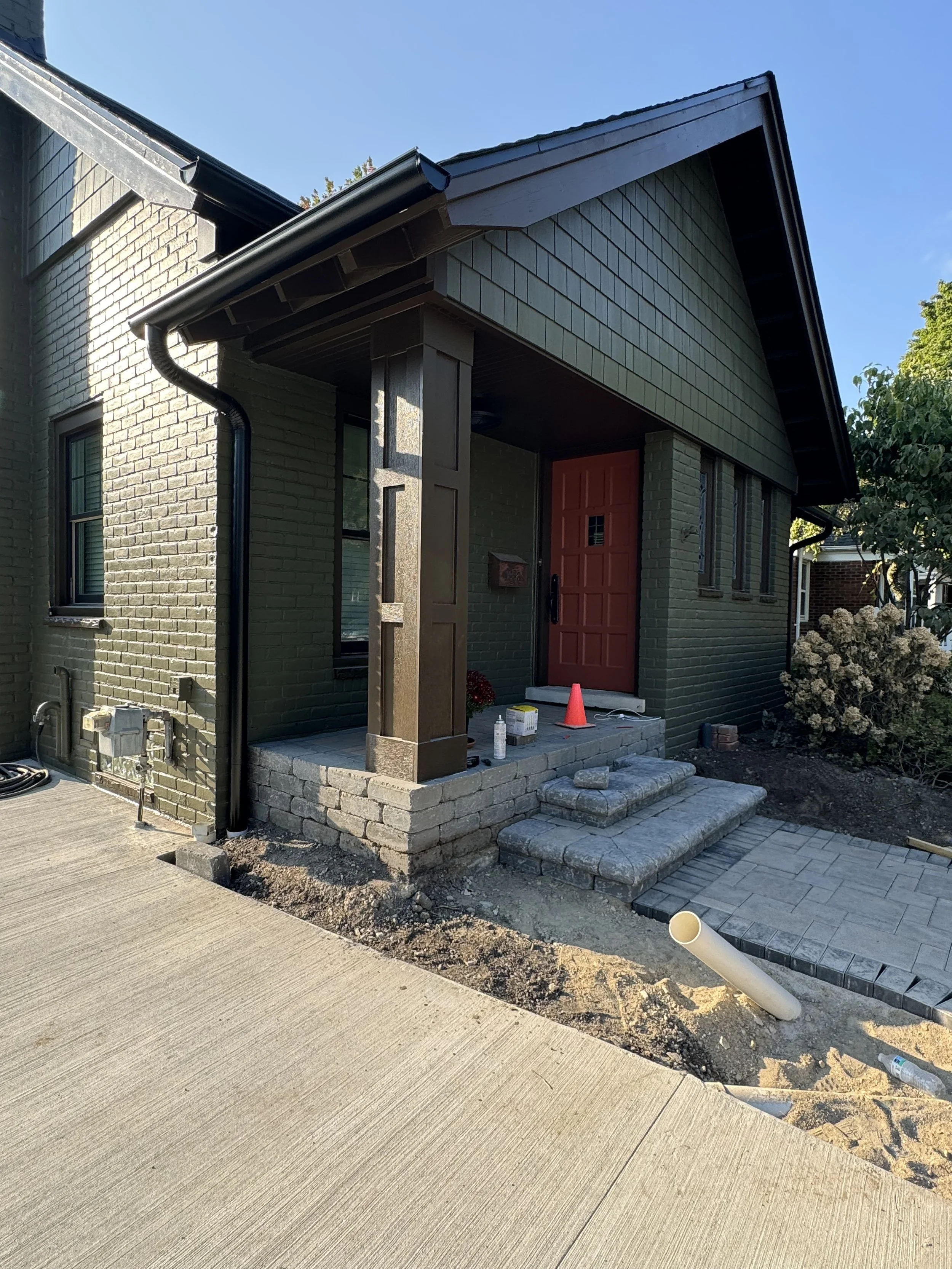 Front porch of a house under construction dads seamless gutters installed black gutter k-style gutters 6' gutters in Bloomfield Hills michigan