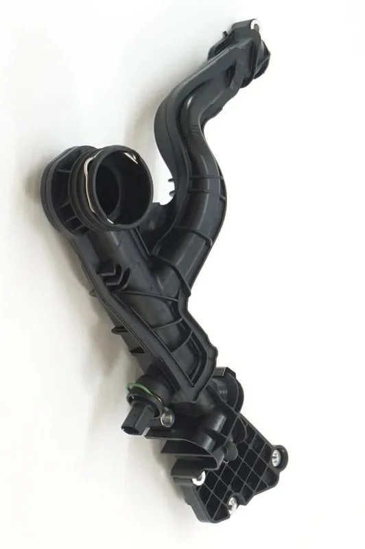 An automotive plastic air intake duct with mounting points and connecting sections.