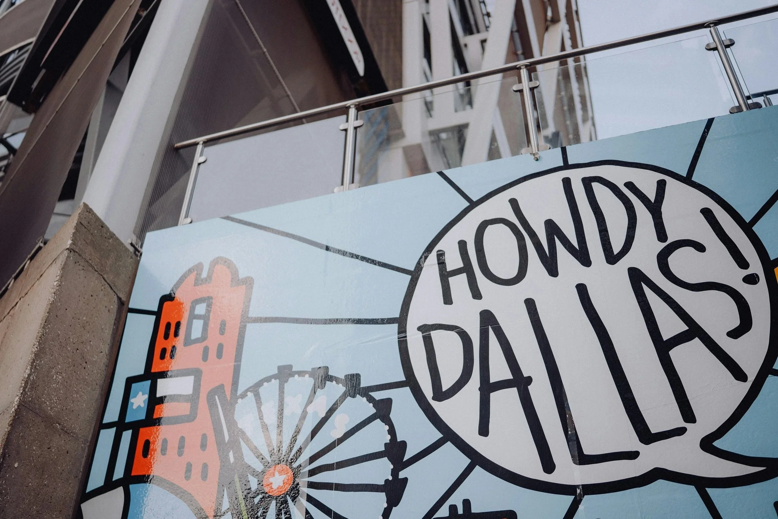 Colorful illustration of the Dallas skyline, including the Reunion Tower, with the words "Howdy Dallas!" in a speech bubble.