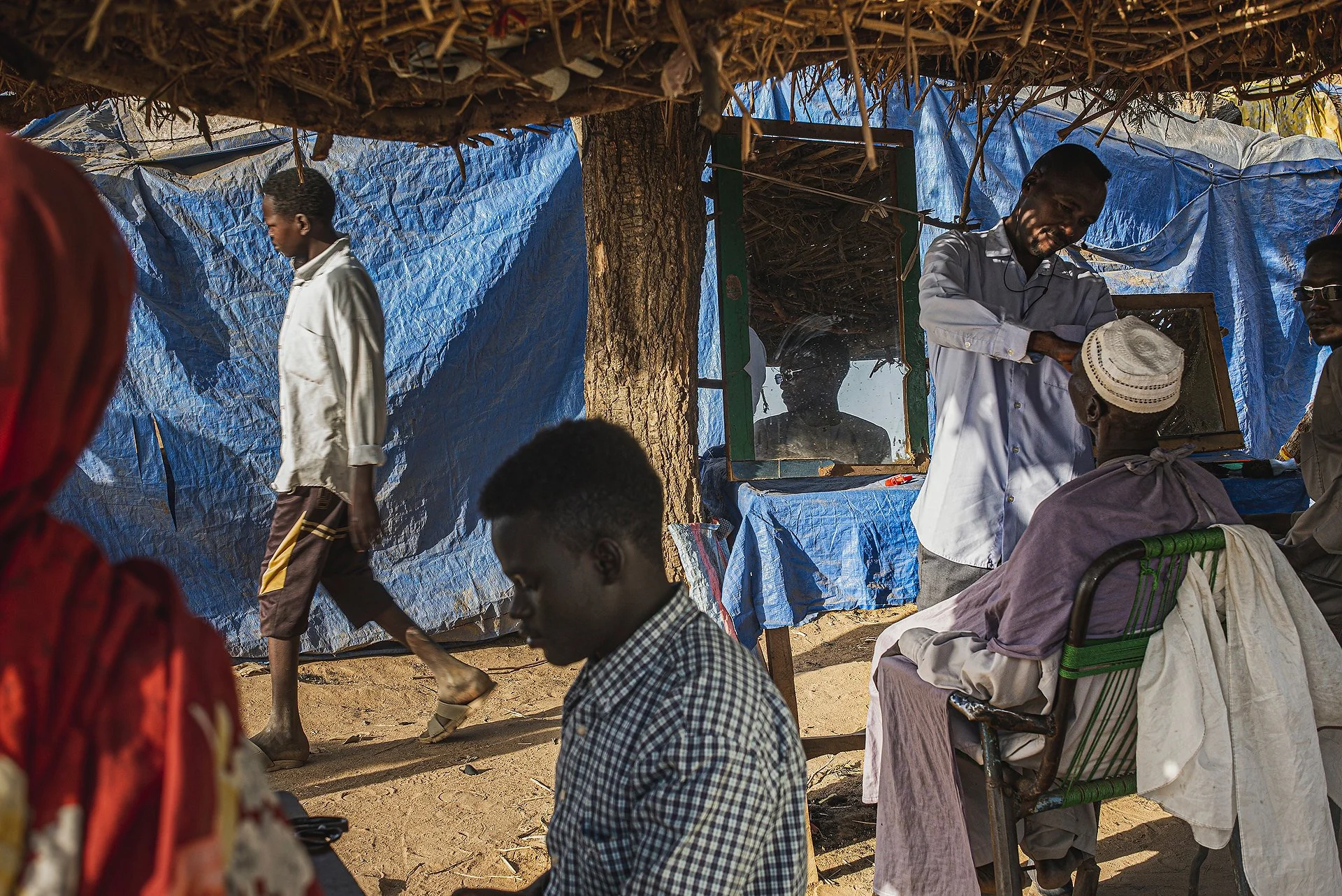 A hairdresser in the Zabout refugee camp in Chad a few kilometers from the Sudanese border.