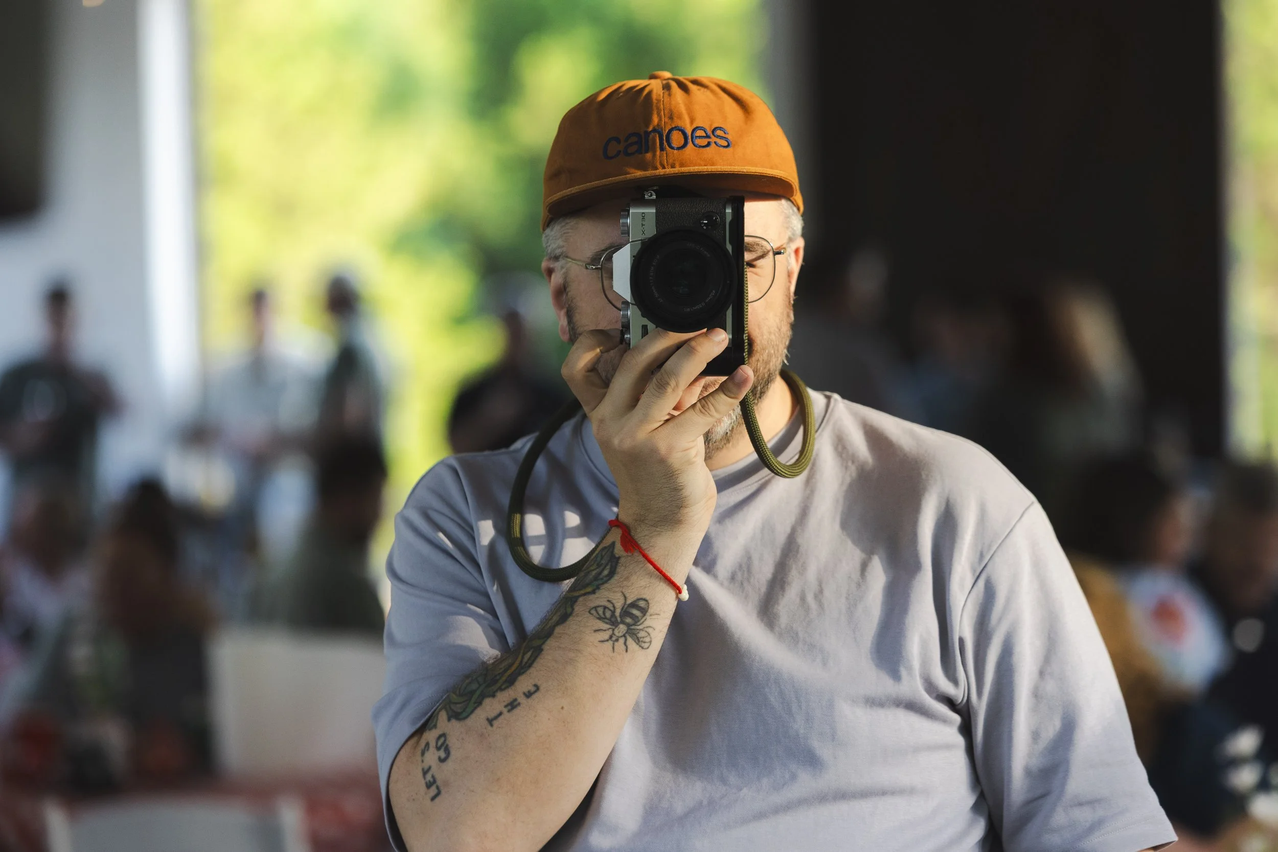 A photo of Moment Foundry Photos owner and creator, Caleb Patton, on-site at Legacy Acres in Conway, Arkansas for a client shoot