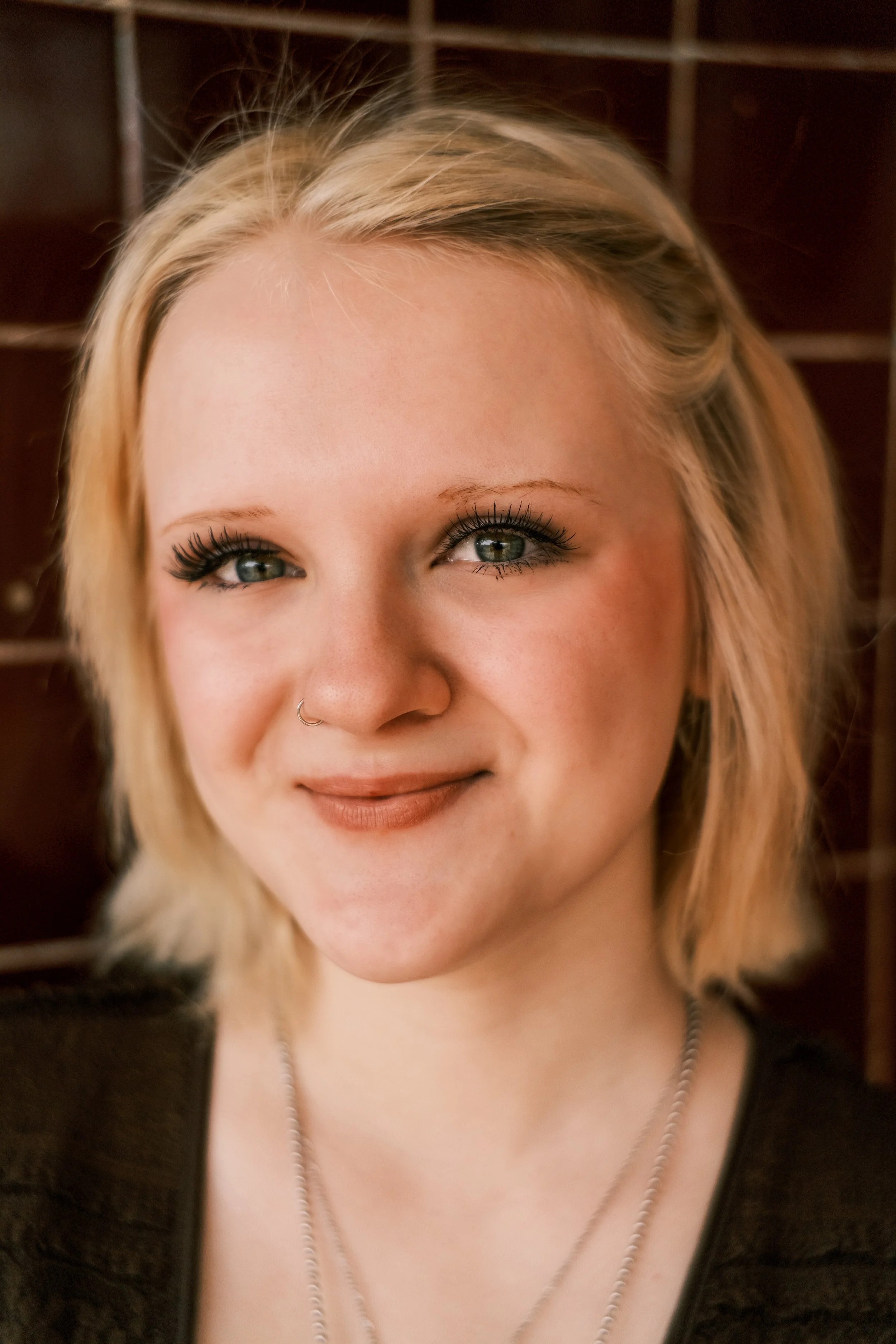 Close-up head shot of Madi in downtown Benton, AR for acting purposes.