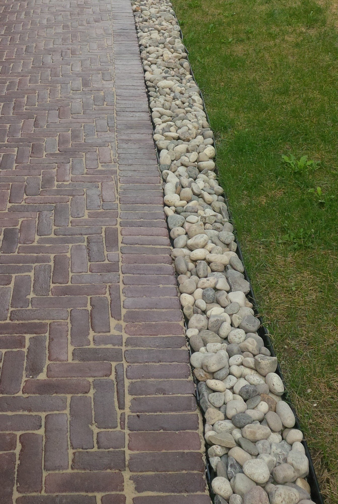 Interlock Walkway with River Rock Border for Proper Drainage - Markham