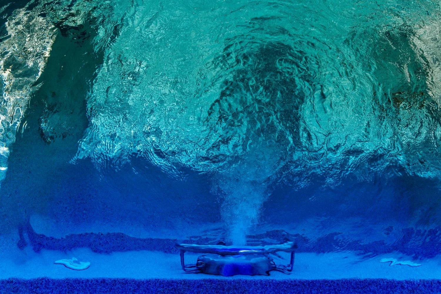 Inground pool with crystal clear water and working jet