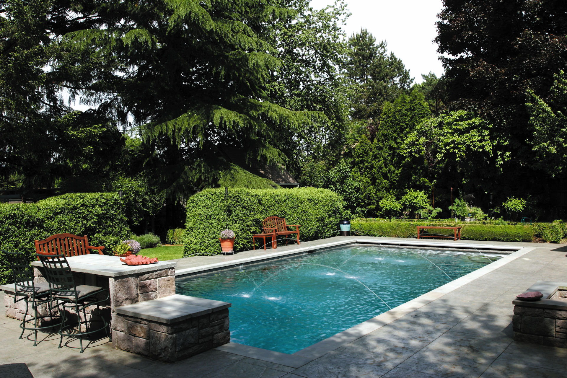 Inground fiberglass pool with water features