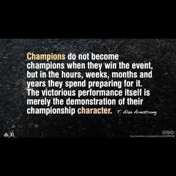 Quote about champions and character on a dark textured background, attributed to T. Alan Armstrong.