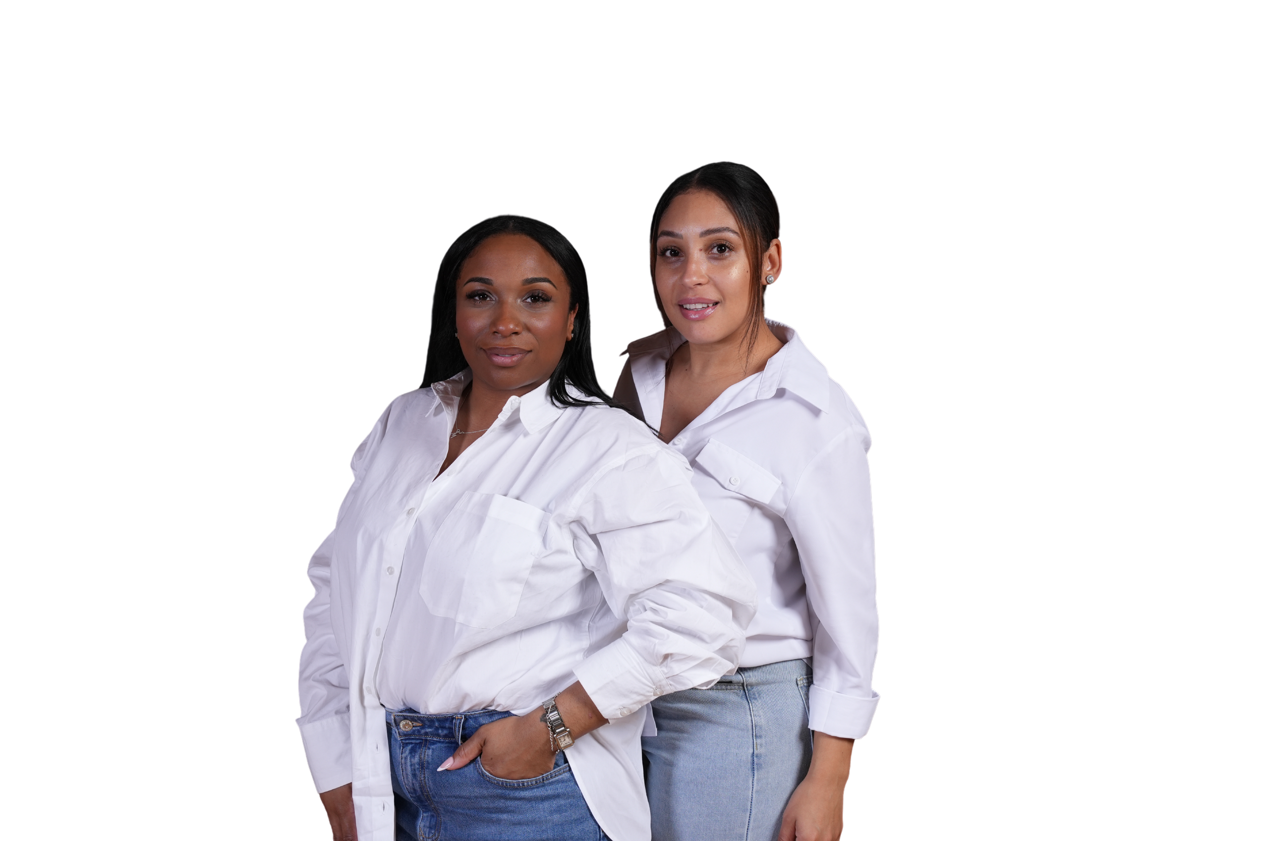Two women standing side by side wearing white shirts and denim jeans.