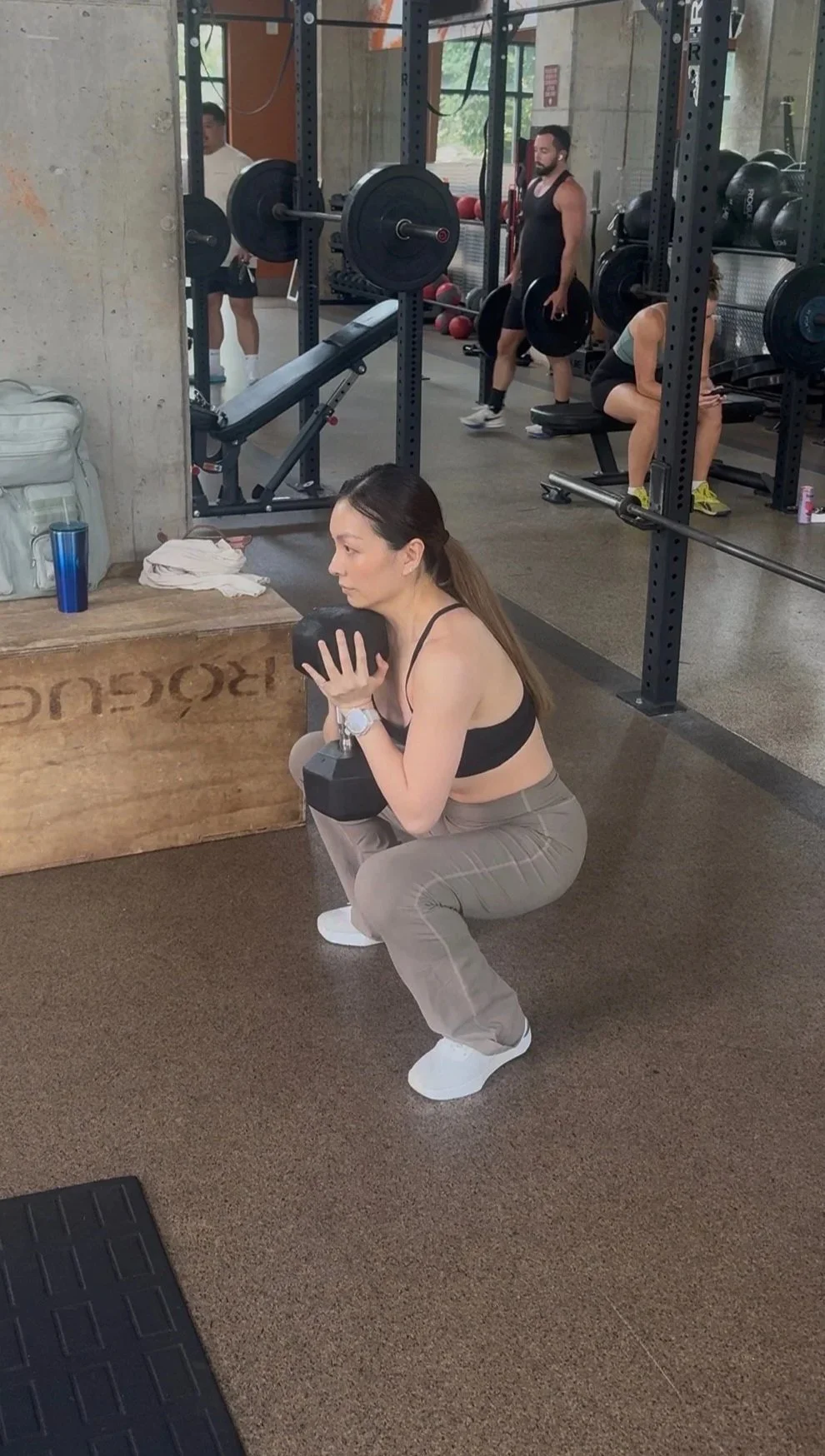 Vivian, personal training client, performing a goblet squat