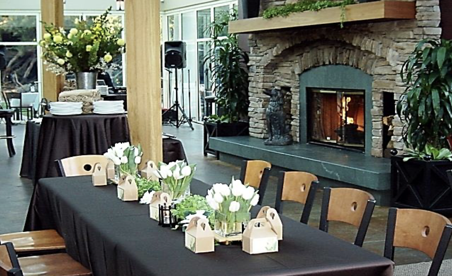 Park Chalet for Parties, Fireplace in background of photo with decorated tables in the foreground.