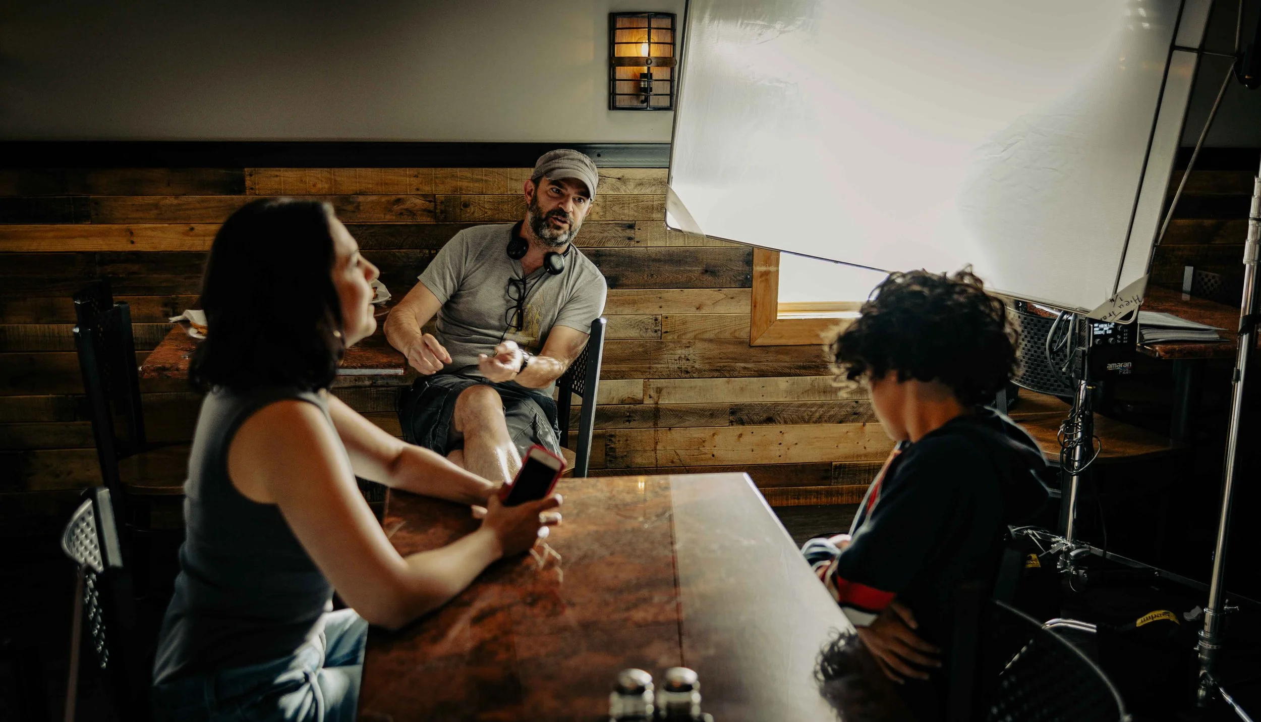 Philadelphia acting coach Sam Hancock working with actors on acting technique before a take on a film set