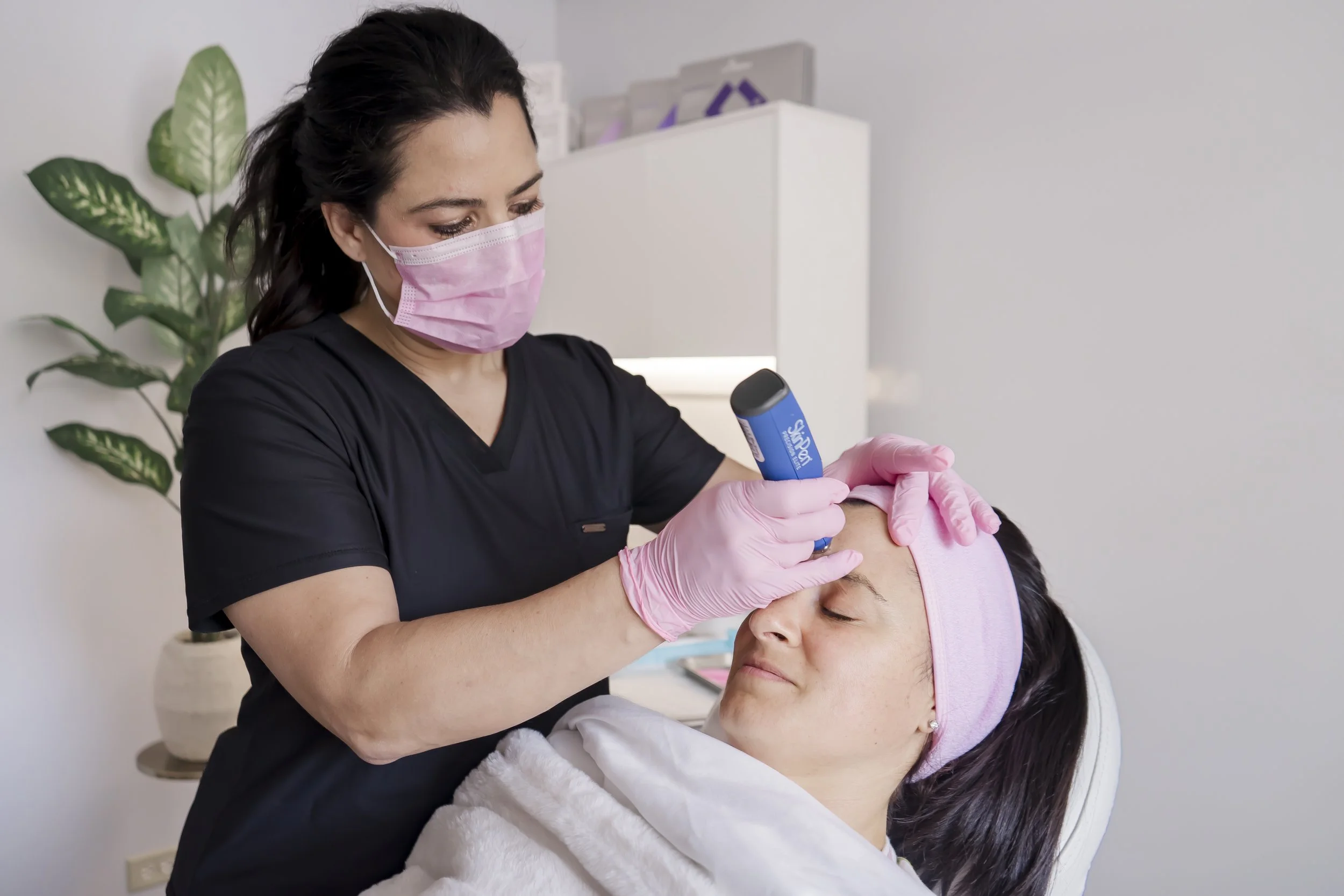 Nurse practitioner performing a professional microneedling treatment on a relaxed client at Carla Thomas Med Spa in La Grange, IL.