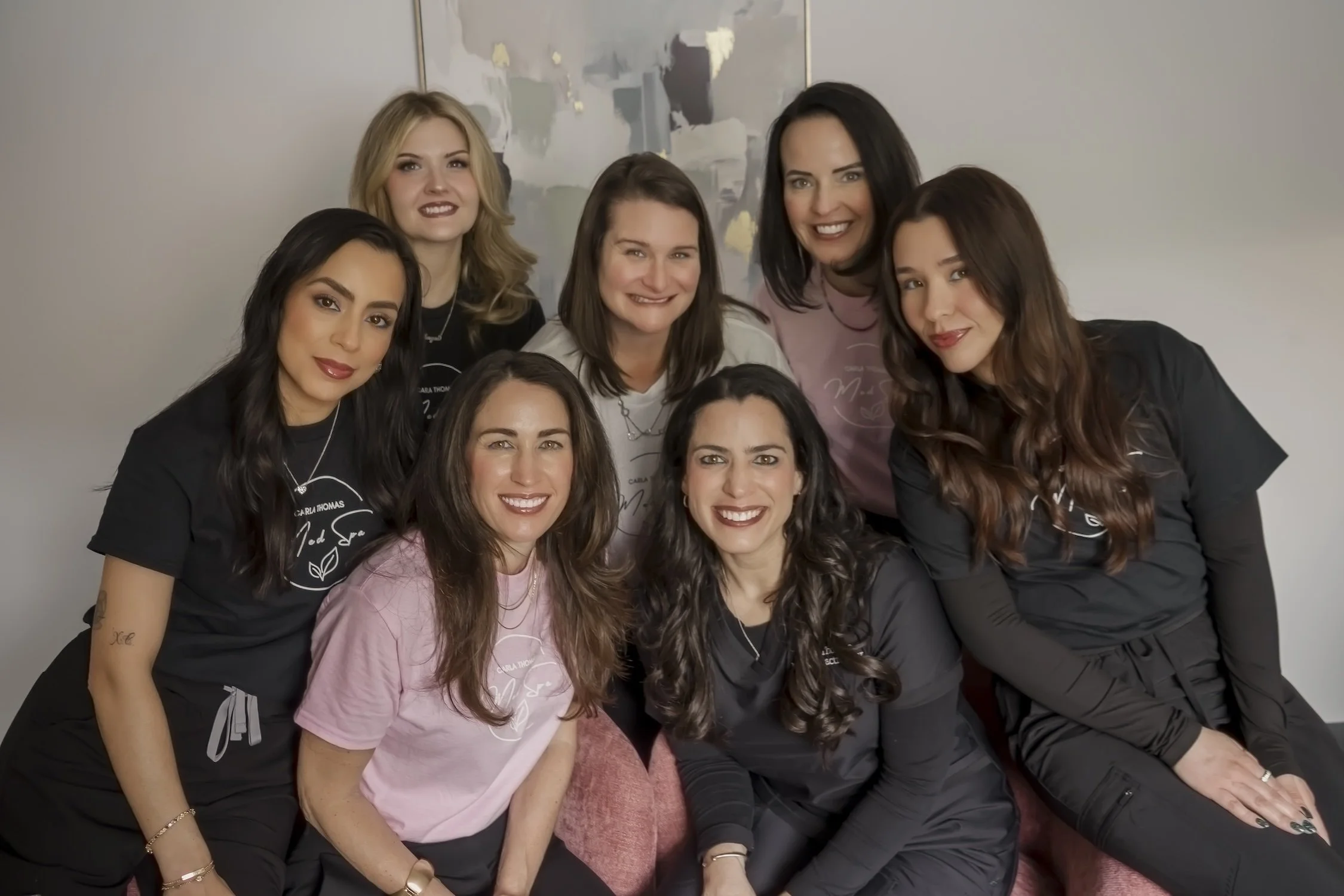 The team at Carla Thomas Med Spa in La Grange, Illinois, including Nurse Practitioner Carla Thomas and staff members smiling together in the med spa.