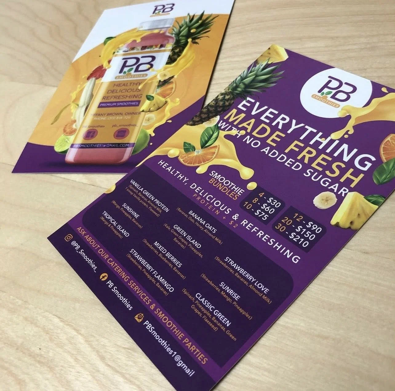 Colorful flyer advertising PB Smoothies featuring a pineapple, banana, and other fruit images, with details about smoothie flavors, prices, and contact information.
