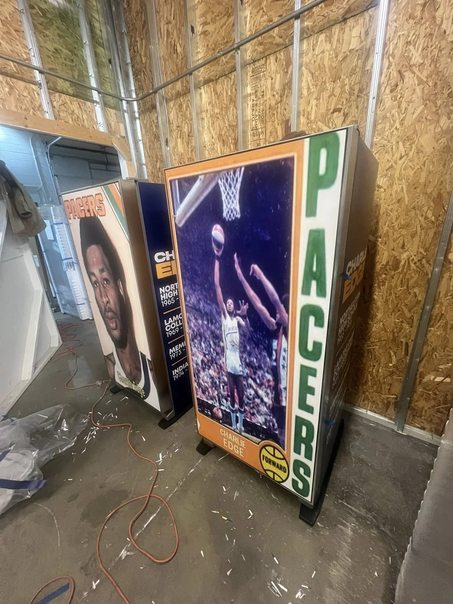 A vintage-style basketball arcade game featuring Charlie Edge, with a photograph of Charlie Edge in a basketball game on the front, showing him jumping to shoot a basketball. The game is labeled with green text reading 'PACERS' and has a small yellow