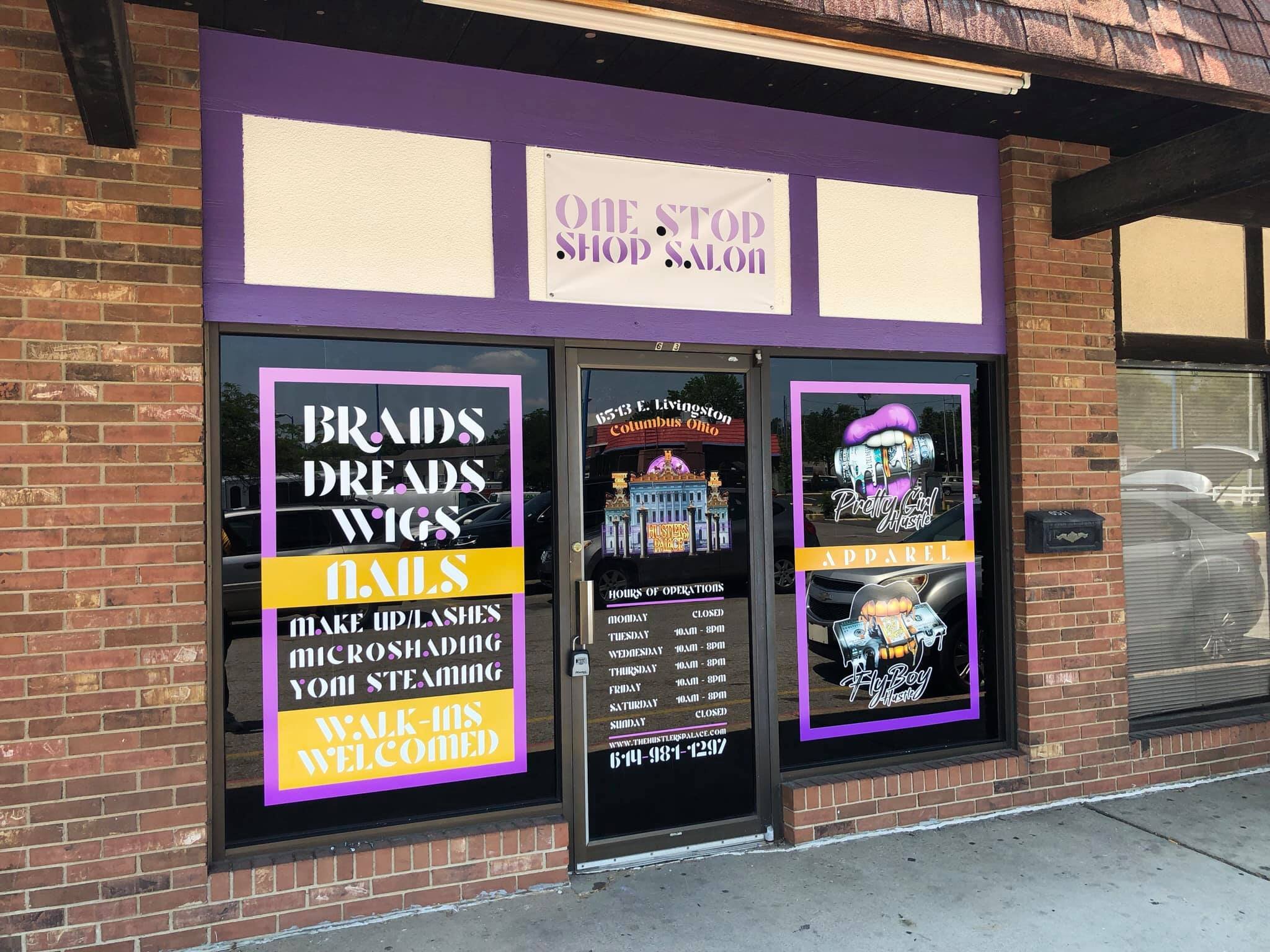 Storefront with purple accents and signs, advertising a beauty and salon shop that offers hair braids, dreadlocks, wigs, nails, makeup, lashes, microblading, and steaming services. The store also welcomes walk-in customers.