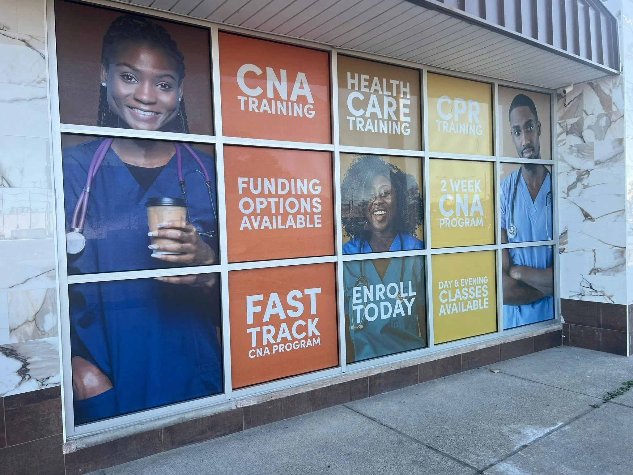 Window display advertising healthcare training programs including CNA, health care, and CPR classes, with images of diverse medical professionals.
