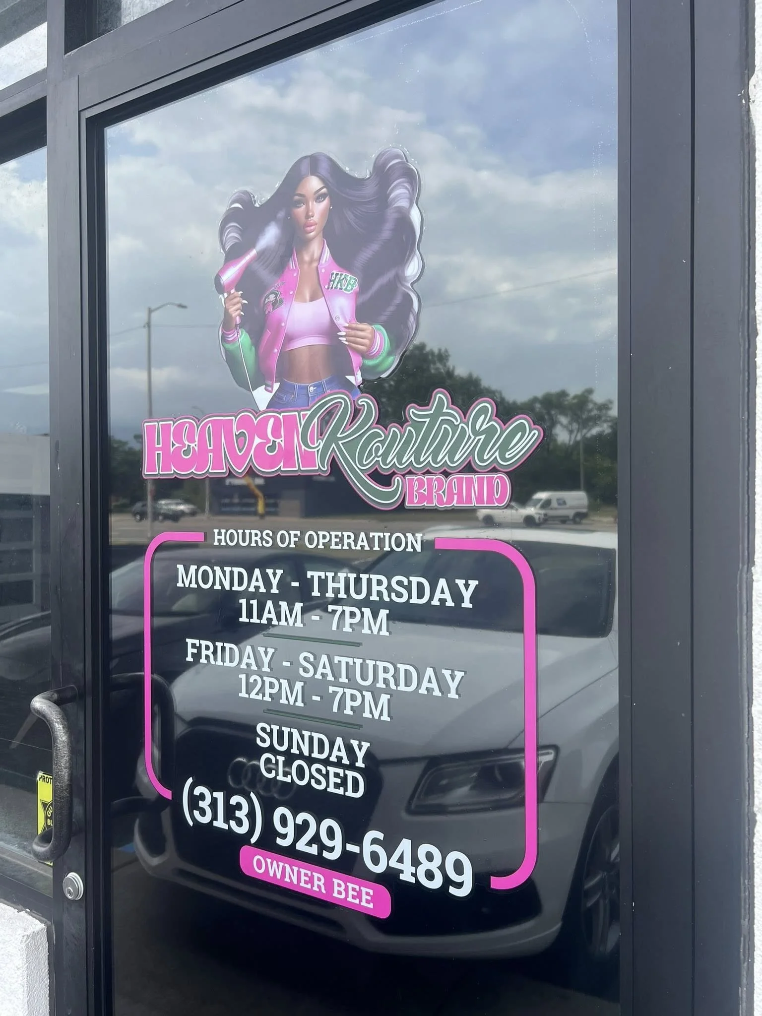 Sign for Heaven Couture Brand hair salon with hours of operation, phone number, and a graphic of a woman with long, flowing hair holding a hairdryer.