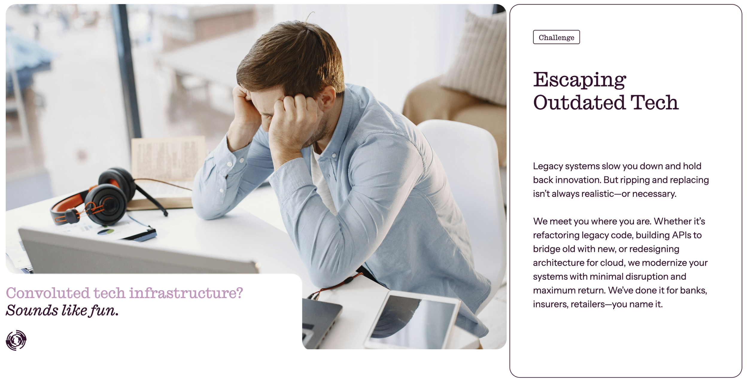 A man with brown hair, wearing a light blue button-up shirt, sitting at a white desk with a laptop, tablets, headphones, and papers; he looks stressed with his hands on his head, sitting near a large window with a busy outdoor scene in the background.