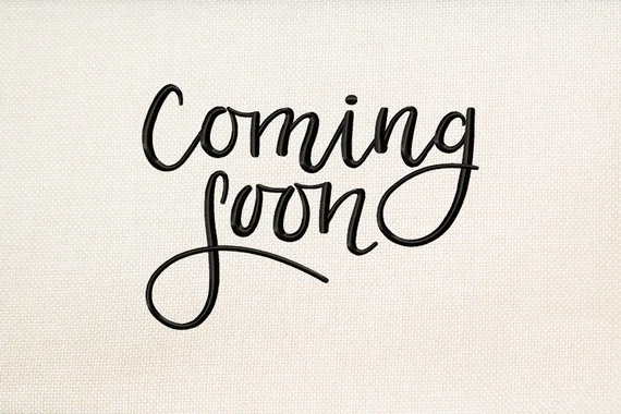 Text that reads 'Coming soon' in black cursive font on a light background.