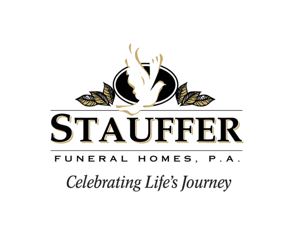 Logo for Stauffer Funeral Homes, P.A., featuring a dove with outstretched wings and decorative leaves, with the tagline 'Celebrating Life’s Journey'.
