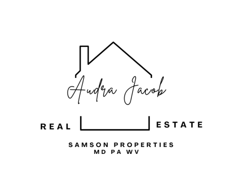 Logo for Audra Jacob Real Estate, featuring a house outline, with the company name in cursive and location abbreviations MD PA WV.