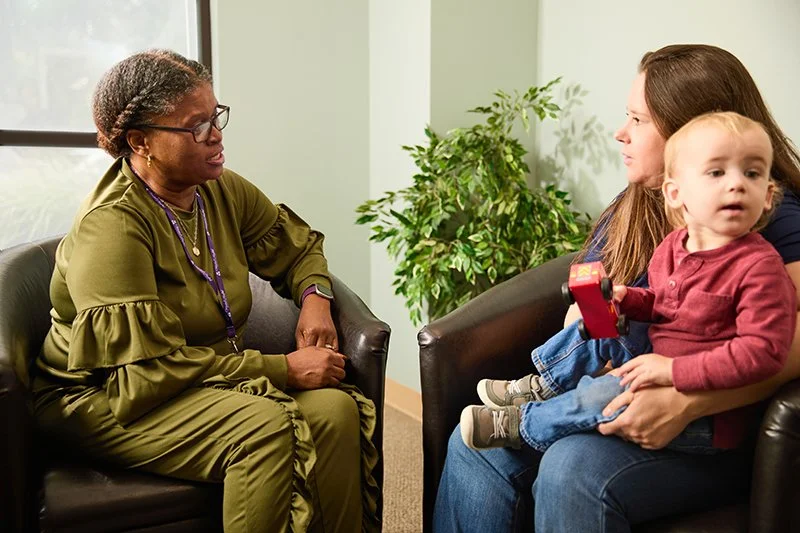 A counseling session with a young child in her lap at the Frederick County MHA
