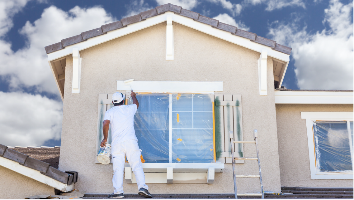 A home improvement contractor working on window installation.