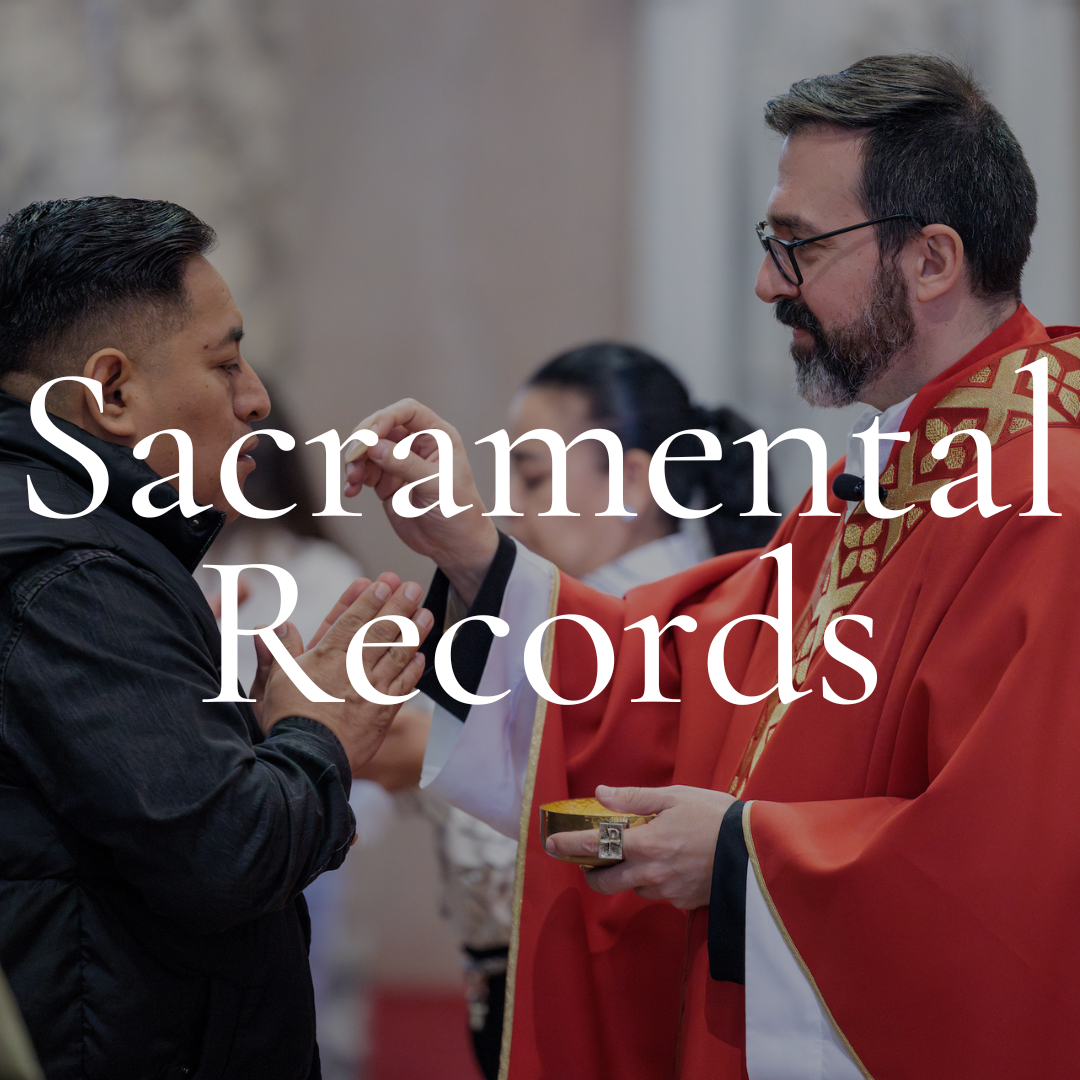 A religious ceremony where a priest, dressed in red and gold vestments, administers Holy Communion to a young man in a black jacket inside a church.