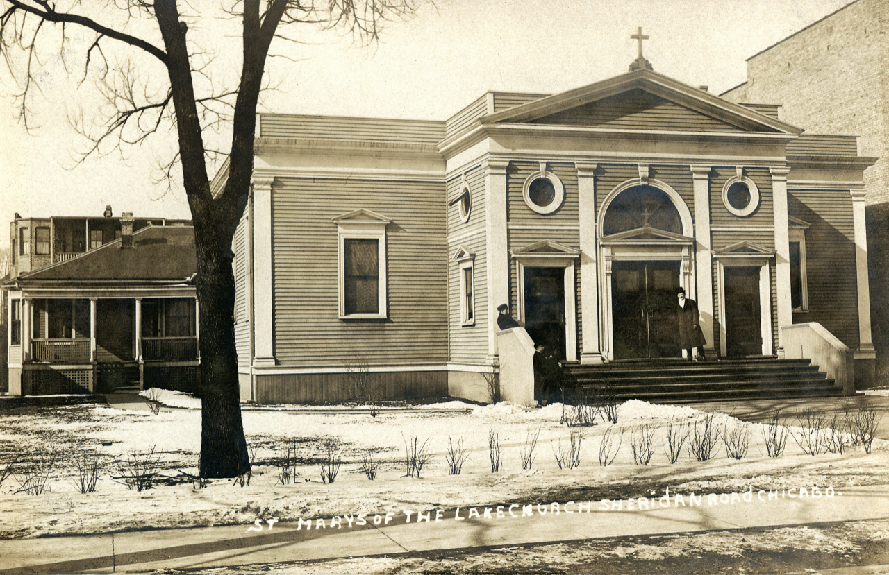 An old black-and-white photo of St. Mary of the Lake Church on Sheridan Road in Chicago, featuring a large wooden building with a cross on top, stairs leading up to the entrance, and a man and woman standing outside.