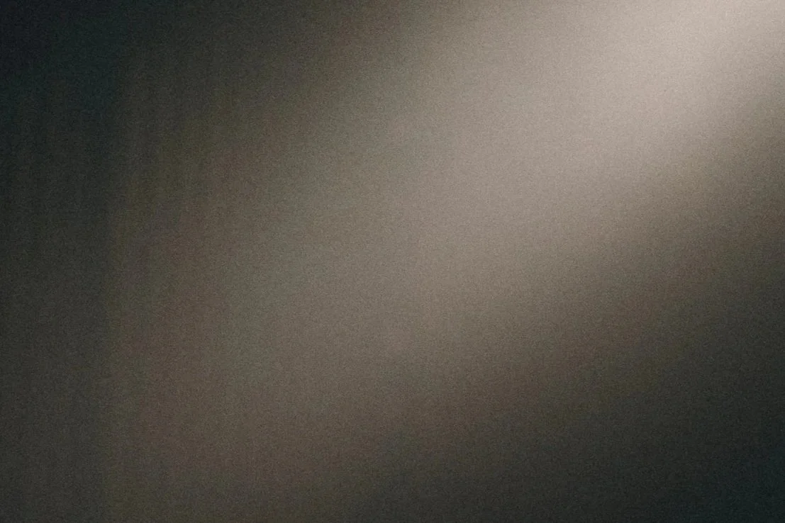 Blurred and dark image with no distinguishable objects or details.