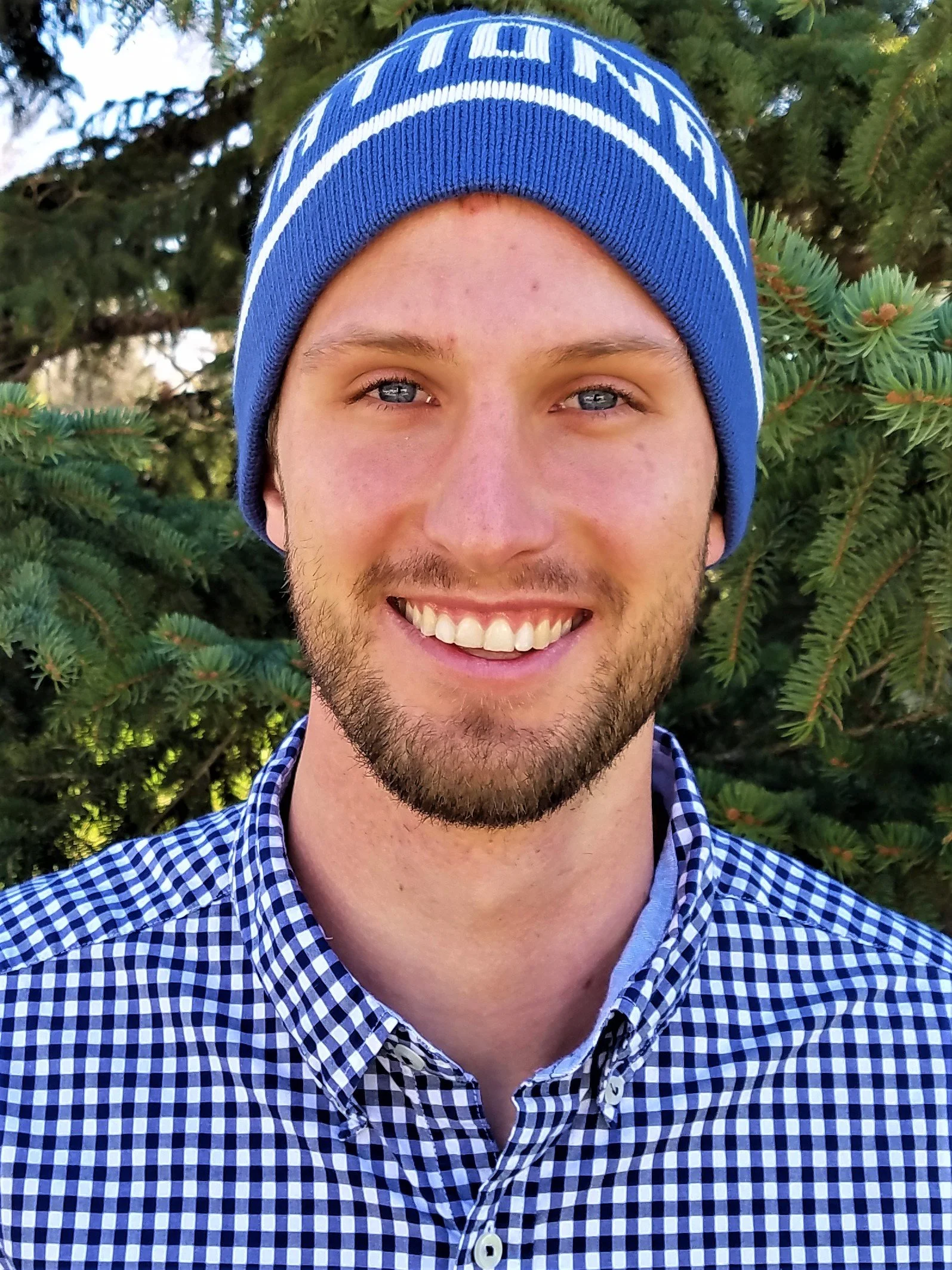 David Leiferman smiling outdoors in front of evergreen trees, a former National Park Ranger and guide for Signature Black Hills Tours