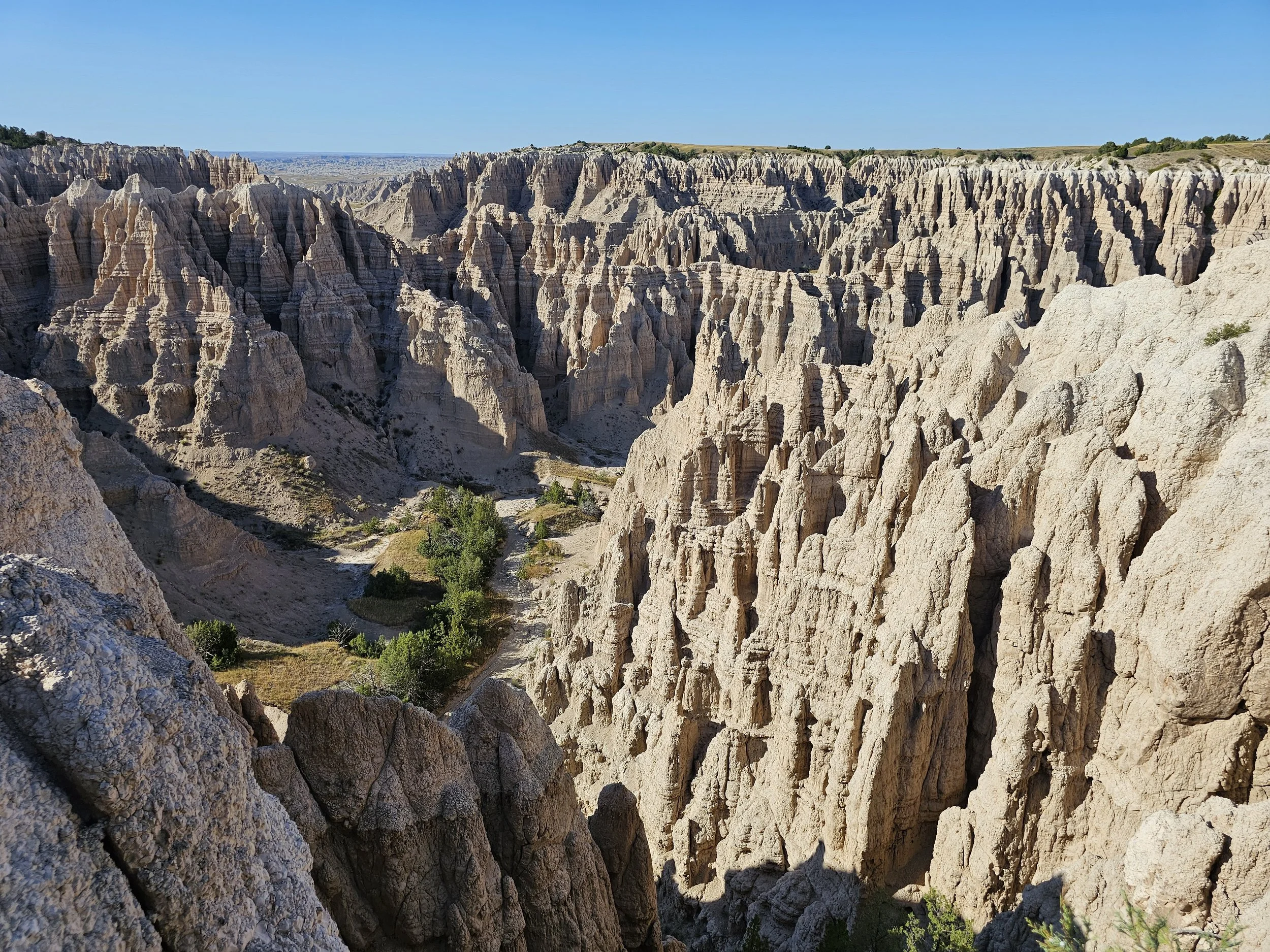 Badlands National Park landscape with layered rock formations and deep ravines in South Dakota
