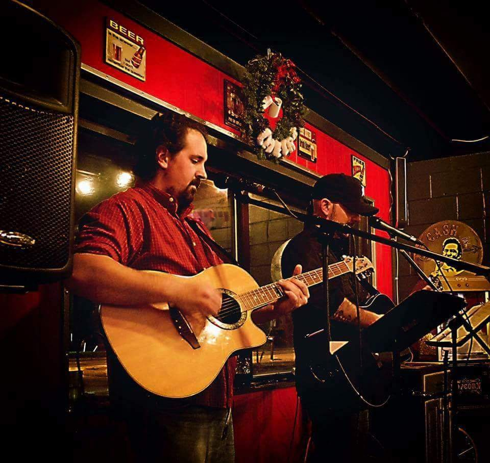 Playing guitar at Redline Brewing with The Shades.