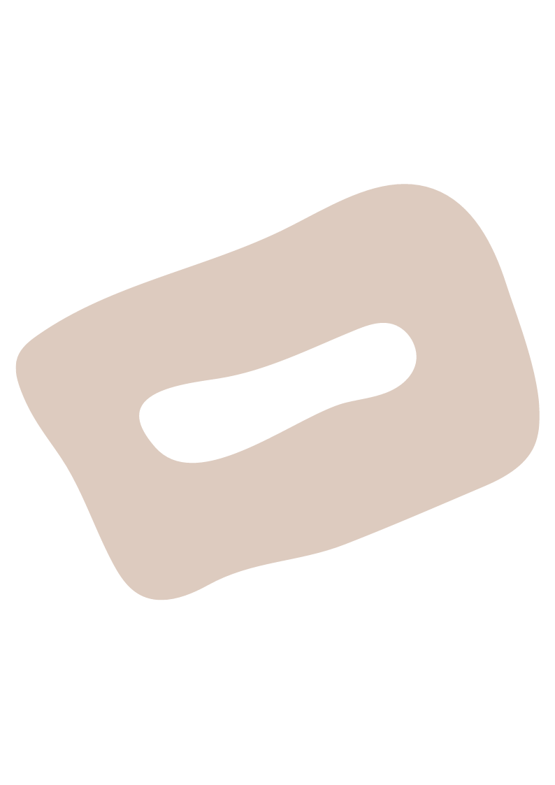 A beige-colored bar of soap with a black oval-shaped cutout in the center.