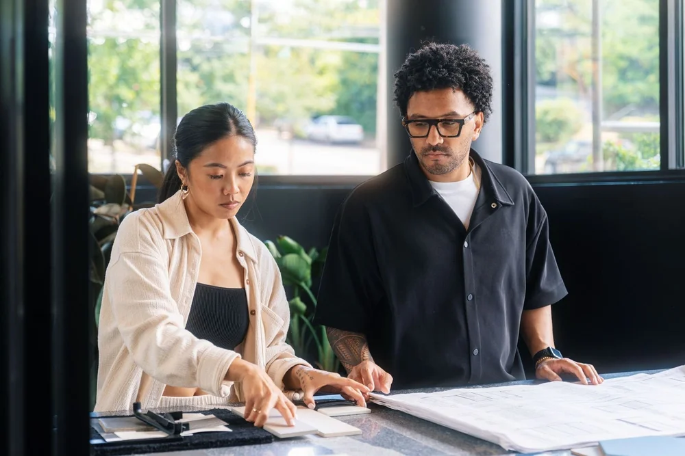 Two business owners reviewing plans together