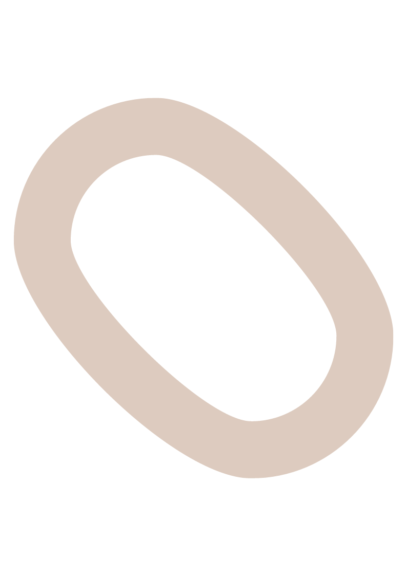 Black background with a beige oval ring tilted at an angle.