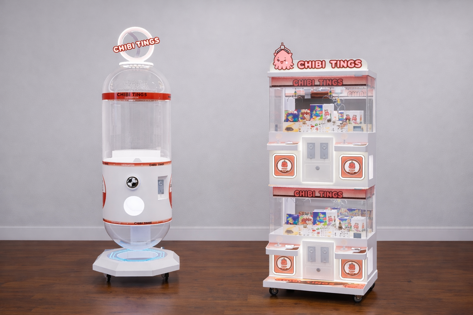 A capsule toy vending machine and a claw machine, both themed with the brand 'Chibi Tings,' are placed on a wooden floor against a gray wall.