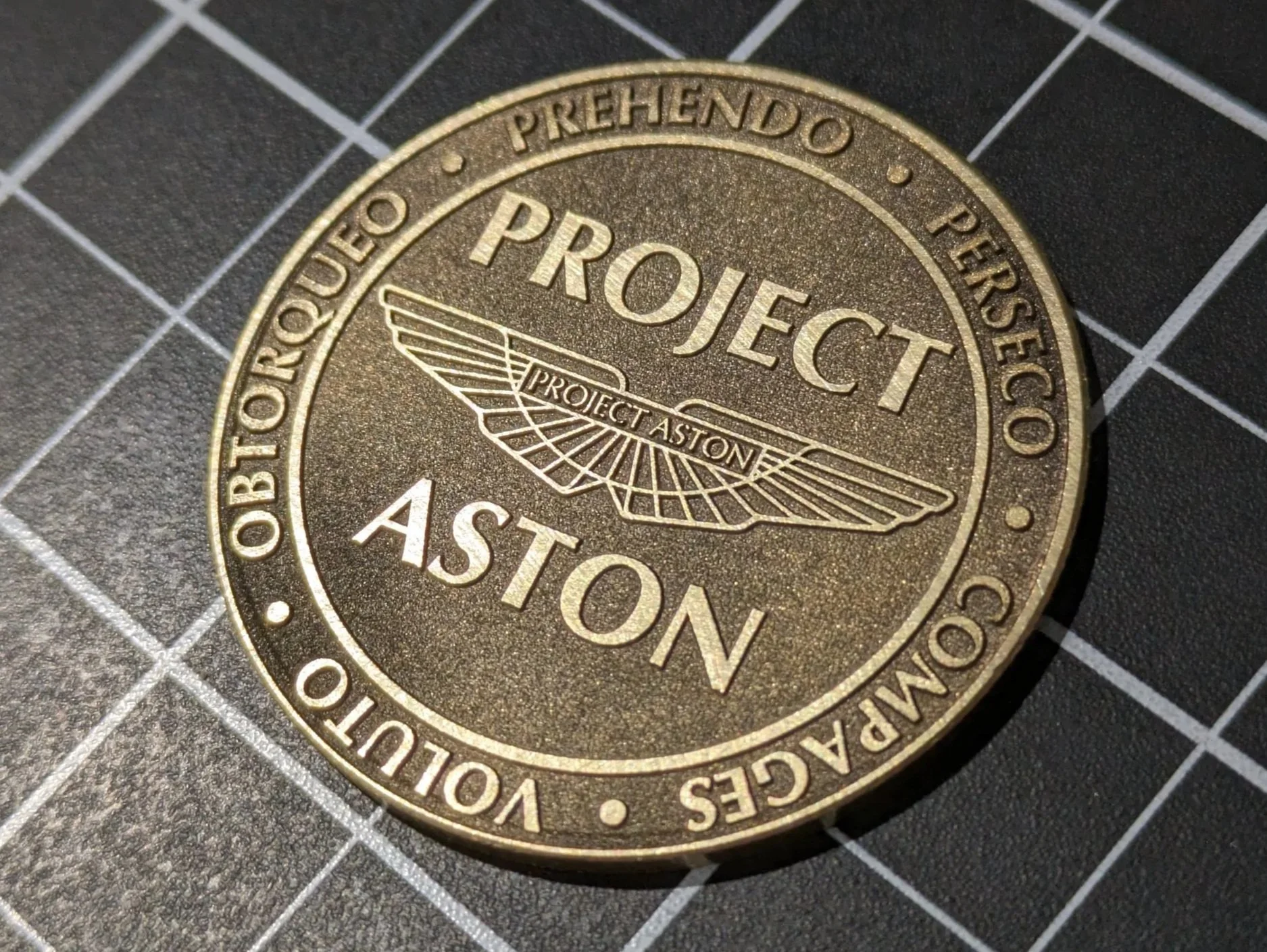 Fiber laser was used to machine away most of the surface of this challenge coin prototype.