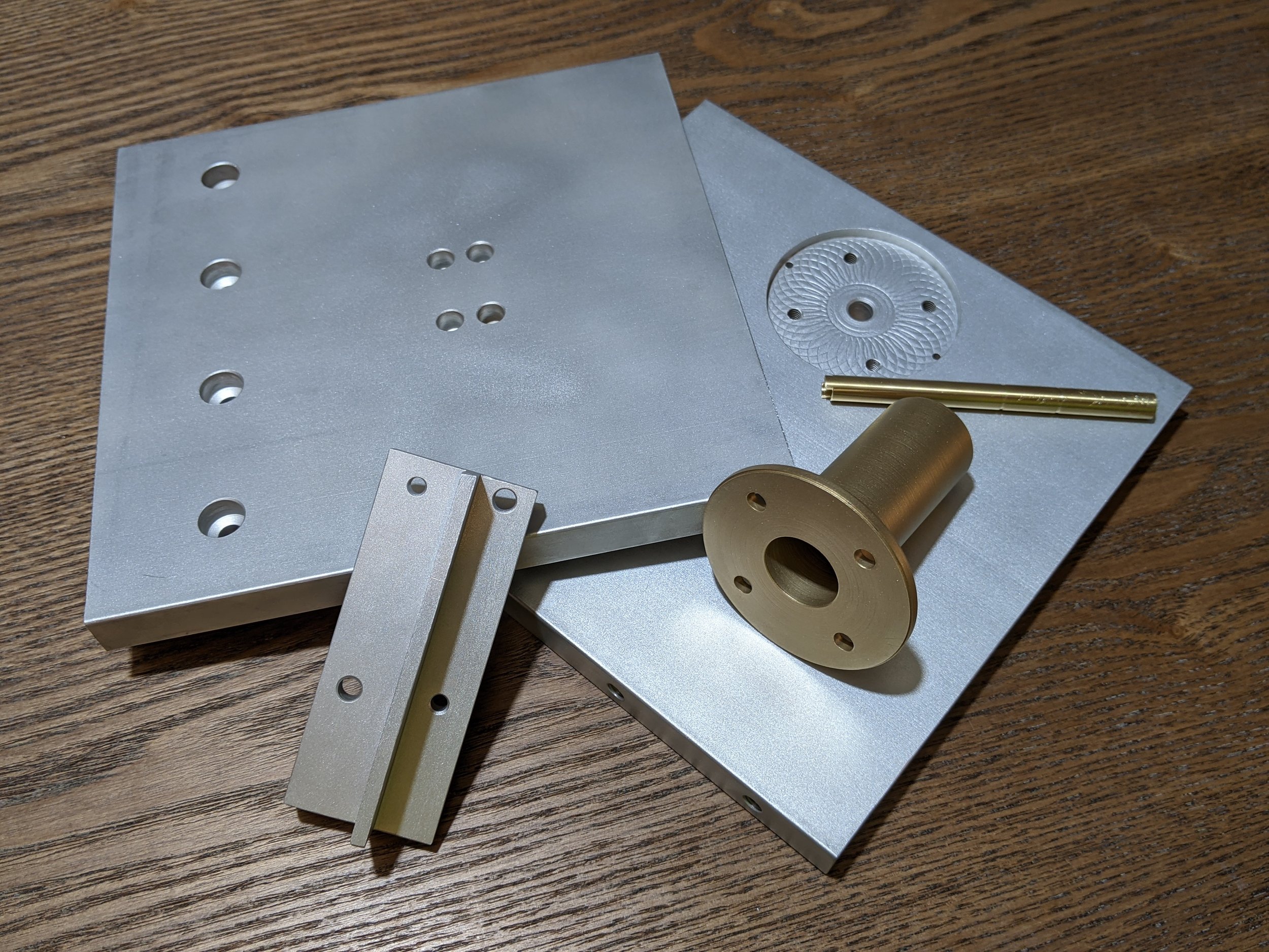 Various machined and turned components for a test fixture assembly.