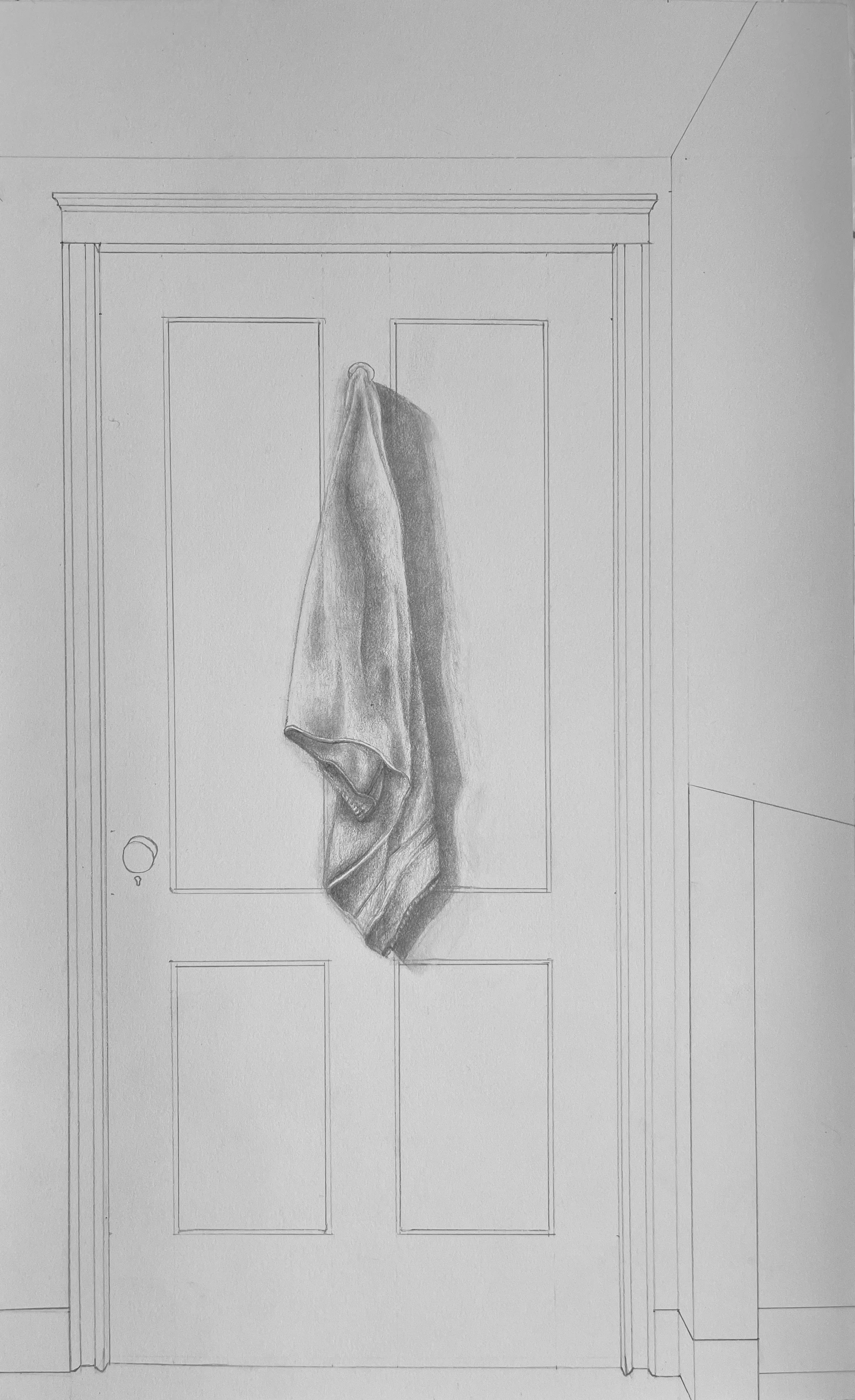 A detailed pencil sketch of a wall with a closed door. A towel hangs from a hook on the door, with shadows cast on the door's surface.
