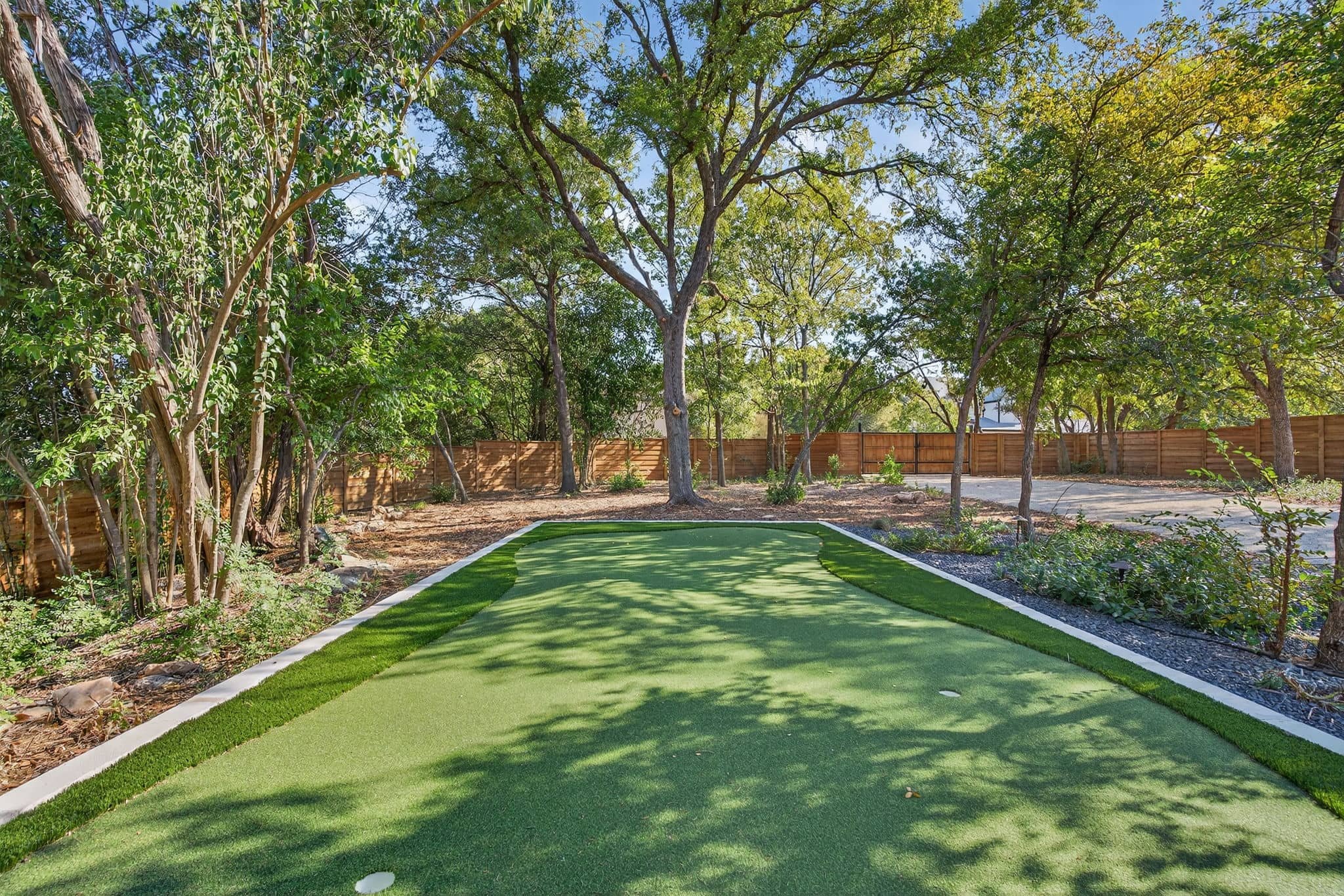 Backyard retreat with modern pool design and private outdoor lounge spaces — Southern Love