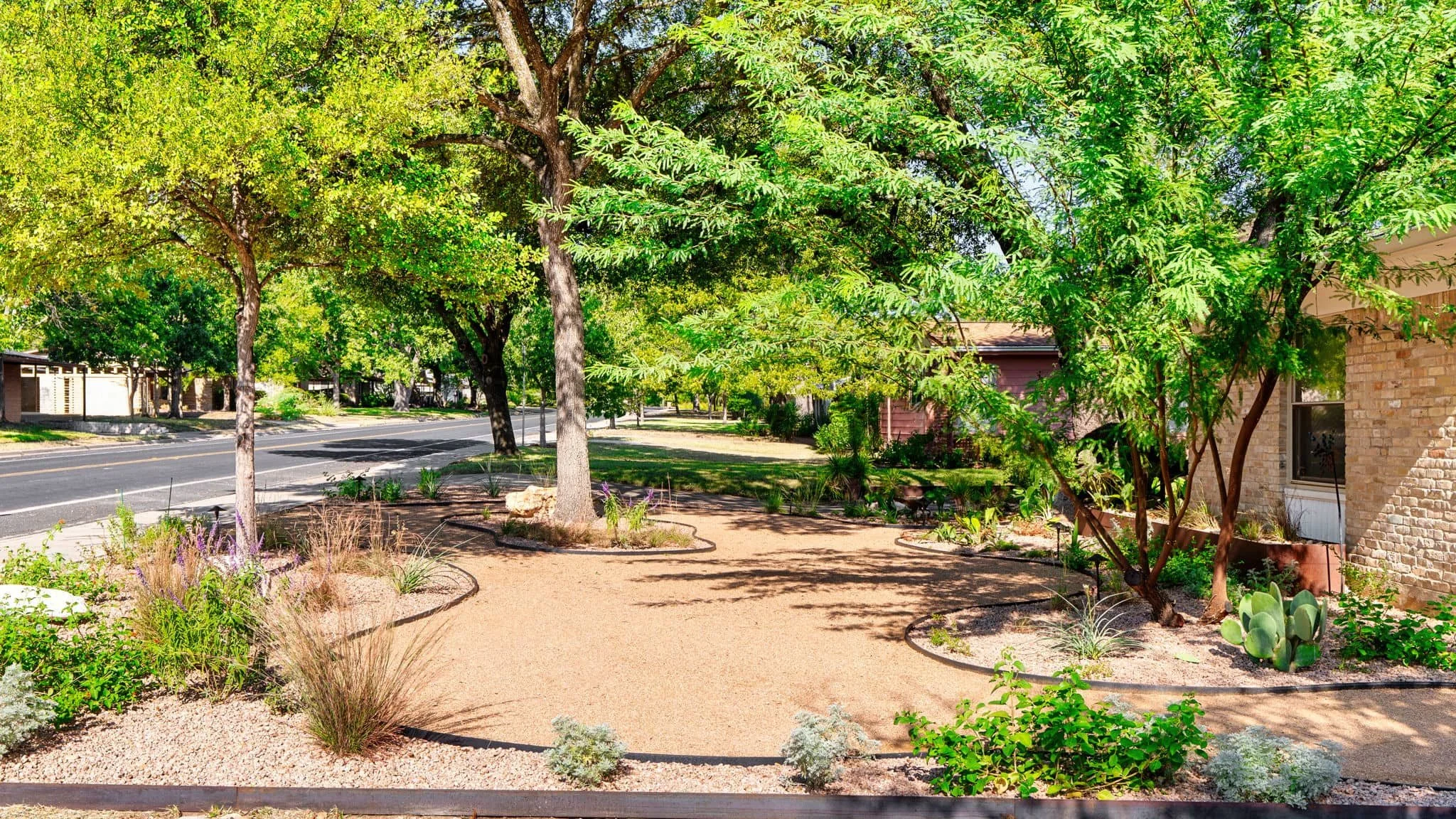 Front entry landscaping designed to complement a traditional brick home exterior — Southern Love