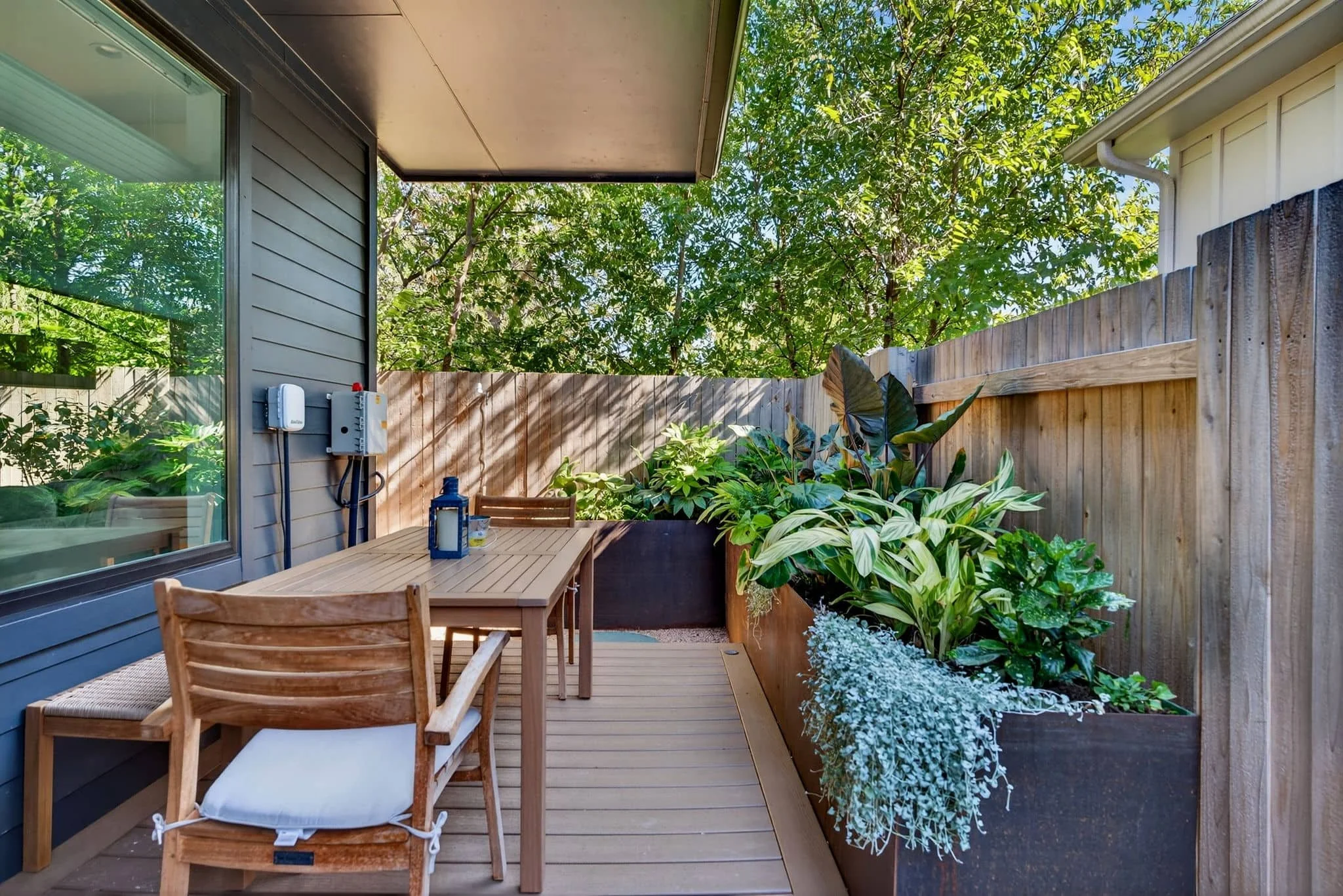 Front and side yard landscaping with lush greenery and inviting entry design — Southern Love