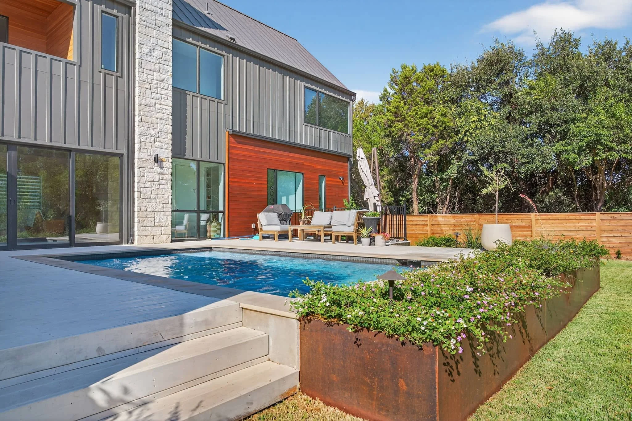 Custom paver patio, retaining wall, and outdoor living construction project in Central Texas — Southern Love