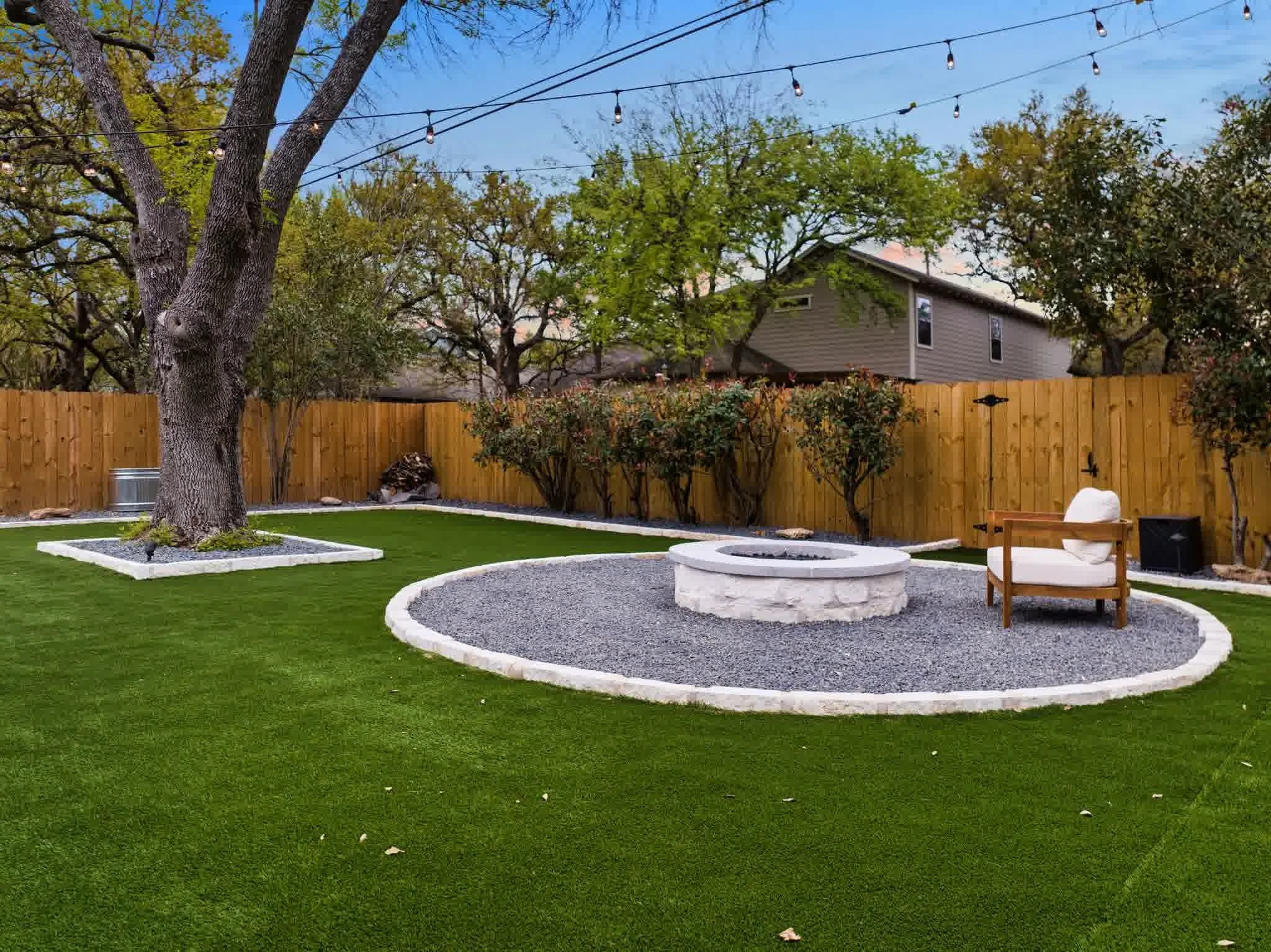 A spotless and perfect firepit with a cozy seat.