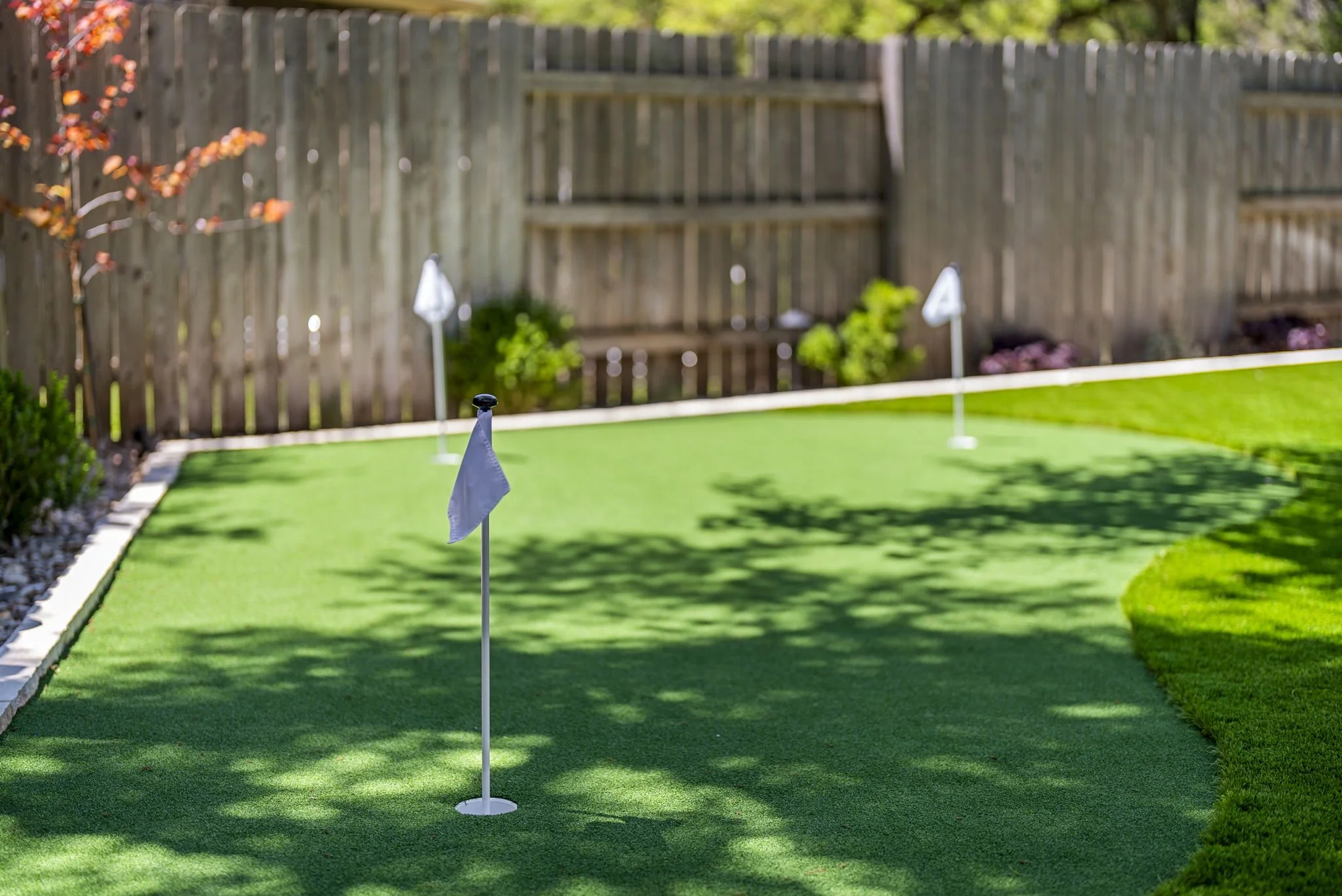 Artificial turf installation for low-maintenance backyard lawn and pet-friendly landscape in Austin, TX